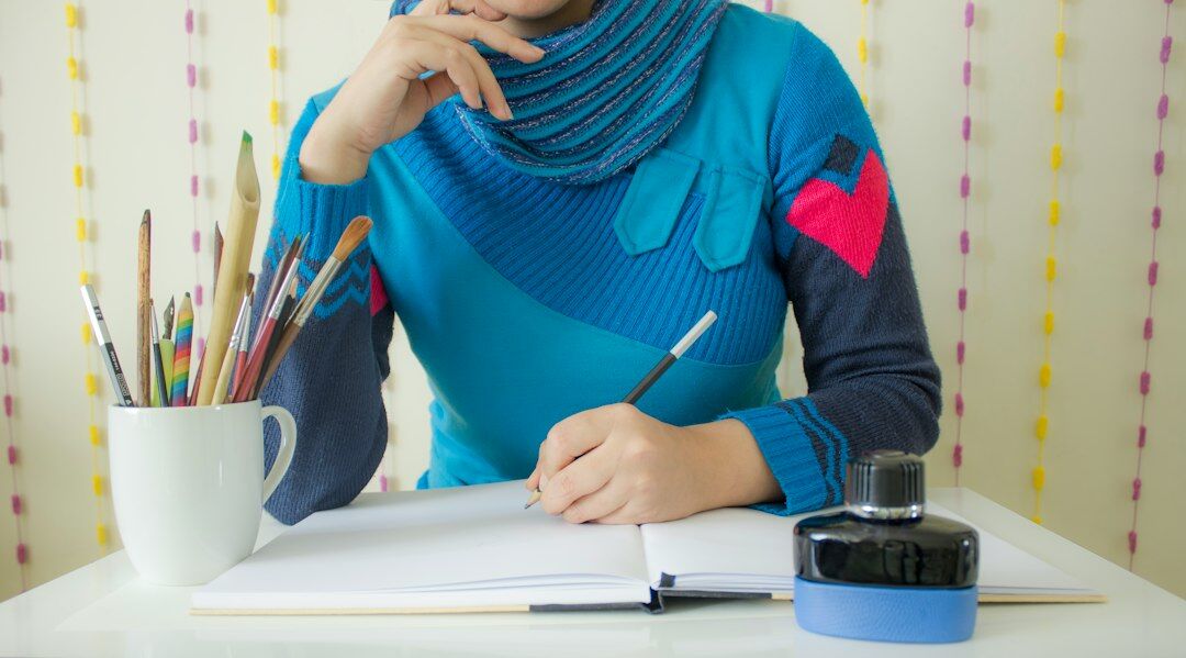 young writer at desk with notebook